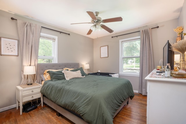 2020 7th St SW, Willmar, MN 56201 - bedroom featuring wood finished floors, baseboards, and ceiling fan