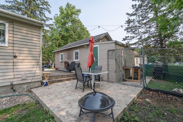 2020 7th St SW, Willmar, MN 56201 - view of patio / terrace with a deck and a fire pit