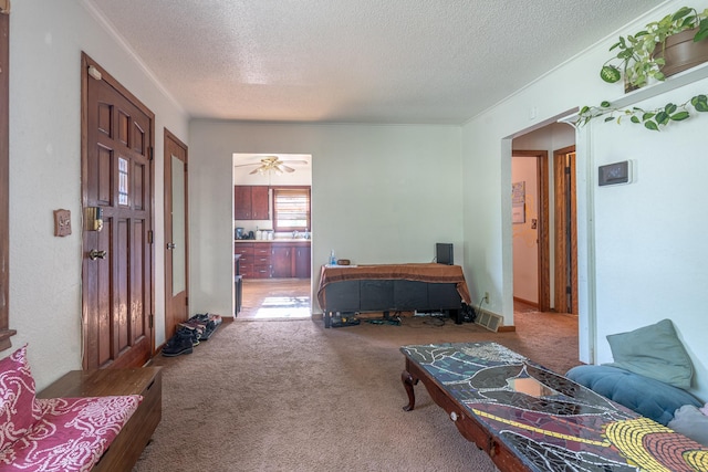 687 Jenks Ave, Saint Paul, MN 55106 - carpeted foyer entrance with arched walkways and a textured ceiling