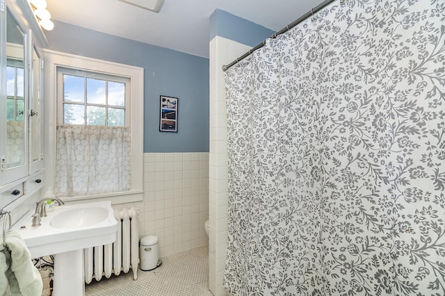 244 Macalester St, Saint Paul, MN 55105 - bathroom with tile walls, wainscoting, curtained shower, and tile patterned floors
