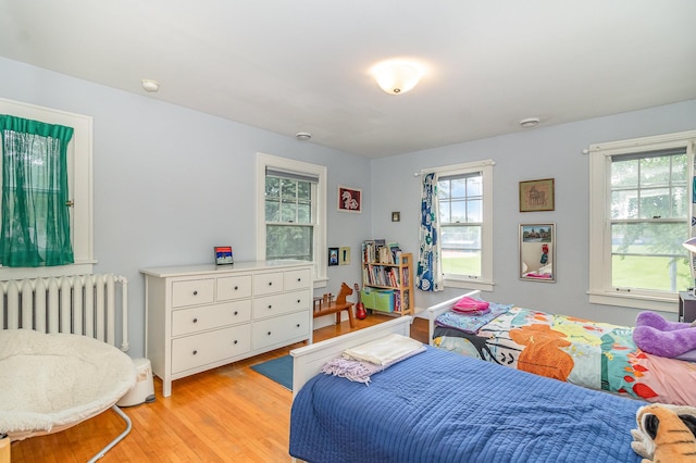 244 Macalester St, Saint Paul, MN 55105 - bedroom featuring radiator and light wood-style floors