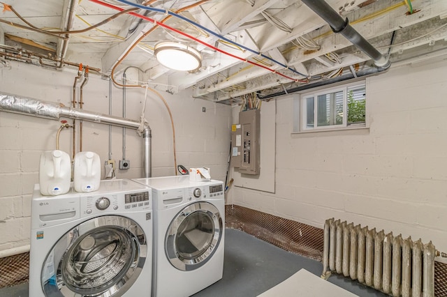 244 Macalester St, Saint Paul, MN 55105 - washroom featuring washing machine and clothes dryer, radiator heating unit, electric panel, and concrete block wall