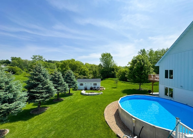 1207 Martin St, Fergus Falls, MN 56537 - swimming pool featuring a yard, a deck, and an outdoor structure