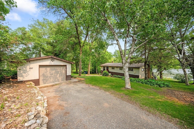 597 Emmet Rd, Lynden Twp, MN 55320 - view of front of property with asphalt driveway, an outbuilding, a detached garage, and a front yard