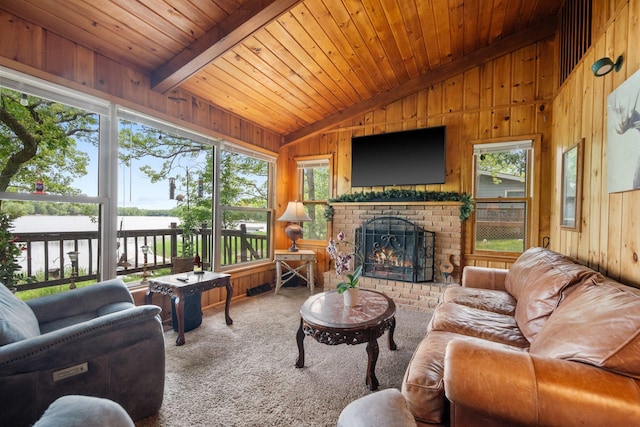 597 Emmet Rd, Lynden Twp, MN 55320 - carpeted living room featuring wood walls, wooden ceiling, plenty of natural light, and a brick fireplace