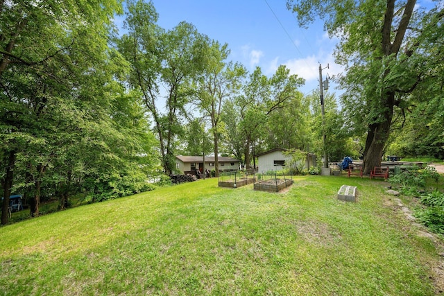 597 Emmet Rd, Lynden Twp, MN 55320 - view of green lawn featuring a garden