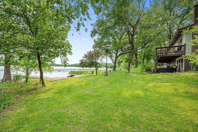 597 Emmet Rd, Lynden Twp, MN 55320 - view of green lawn with a deck with water view