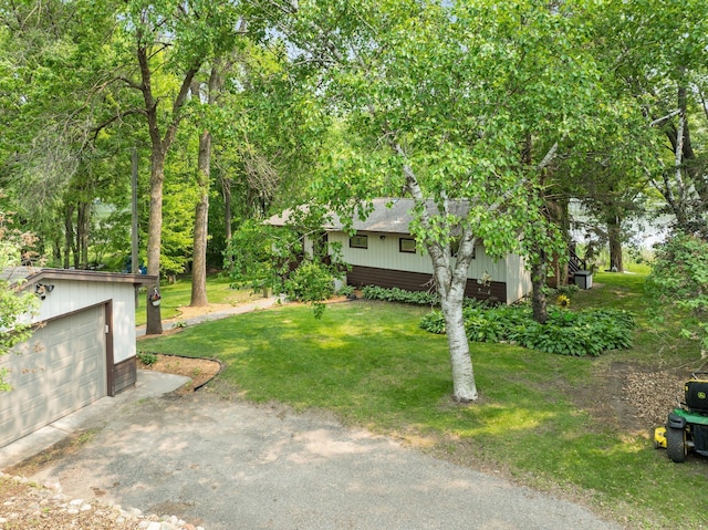597 Emmet Rd, Lynden Twp, MN 55320 - view of green lawn with an outbuilding and a garage