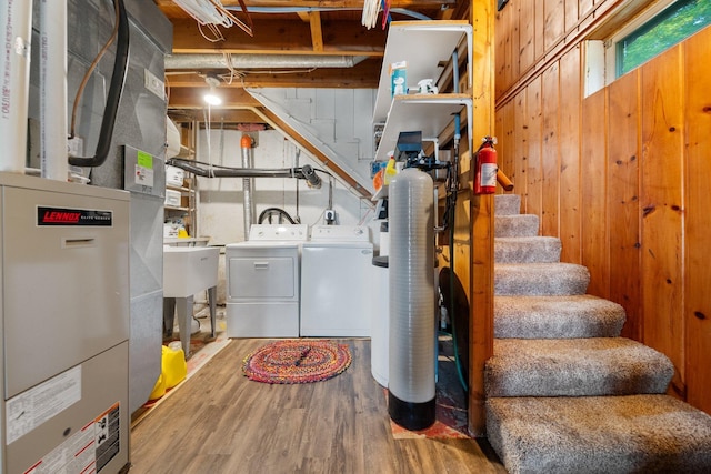 597 Emmet Rd, Lynden Twp, MN 55320 - basement with heating unit, wood finished floors, stairway, independent washer and dryer, and wooden walls