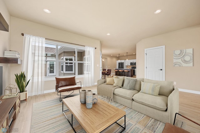 842 Rania Way W, West Fargo, ND 58078 - living room with light wood-type flooring, recessed lighting, and baseboards