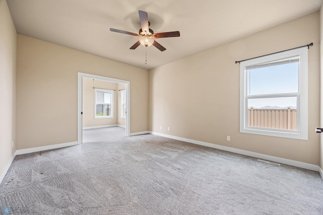 842 Rania Way W, West Fargo, ND 58078 - carpeted spare room with ceiling fan and baseboards