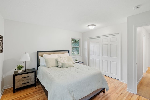 13001 Glenview Dr, Burnsville, MN 55337 - bedroom featuring light wood-type flooring and a closet