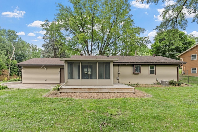 13001 Glenview Dr, Burnsville, MN 55337 - rear view of property featuring a patio area, a sunroom, and a yard