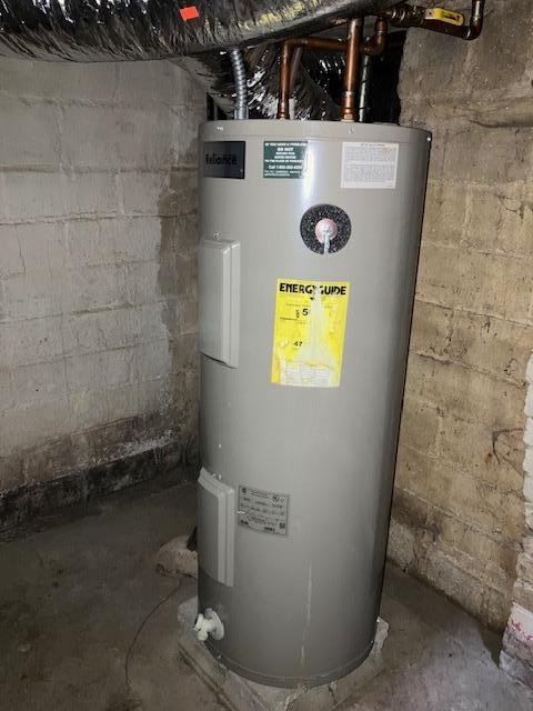 607 3rd St SW, Waseca, MN 56093 - utility room featuring electric water heater