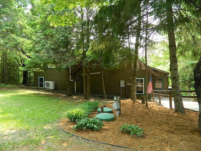 3749 Grizzly Ln, Barnum Twp, MN 55707 - view of side of home featuring ac unit and a yard