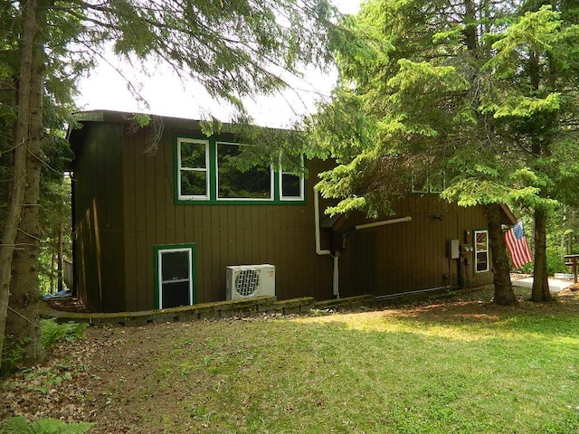 3749 Grizzly Ln, Barnum Twp, MN 55707 - view of property exterior featuring ac unit and a yard