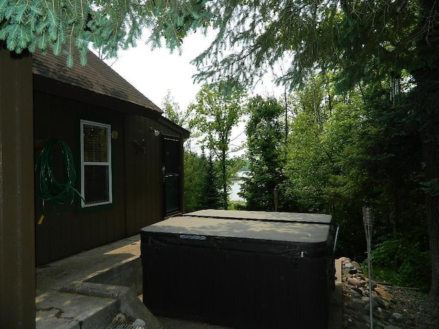 3749 Grizzly Ln, Barnum Twp, MN 55707 - view of patio / terrace with a hot tub