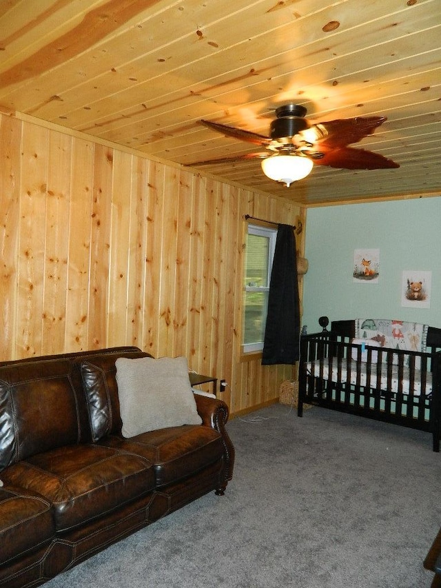 3749 Grizzly Ln, Barnum Twp, MN 55707 - living area with carpet floors, a ceiling fan, wooden ceiling, and wooden walls