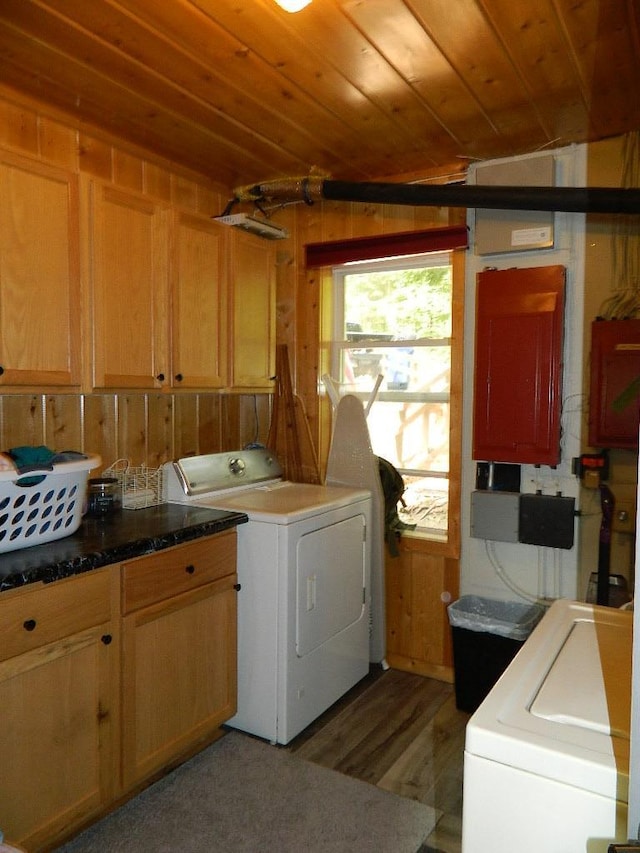 3749 Grizzly Ln, Barnum Twp, MN 55707 - laundry area featuring cabinet space, washing machine and clothes dryer, wooden ceiling, and light wood-style floors