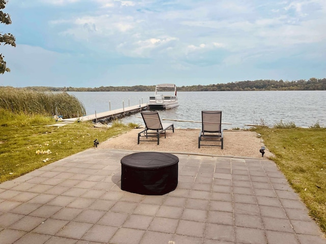 3832 Norris Ave NW, French Lake Twp, MN 55302 - view of patio / terrace featuring an outdoor fire pit, a dock, and a water view