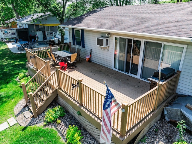 3832 Norris Ave NW, French Lake Twp, MN 55302 - wooden terrace featuring outdoor dining area and a wall unit AC