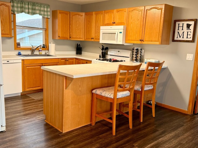 3832 Norris Ave NW, French Lake Twp, MN 55302 - kitchen with white appliances, dark wood-type flooring, light countertops, and a breakfast bar