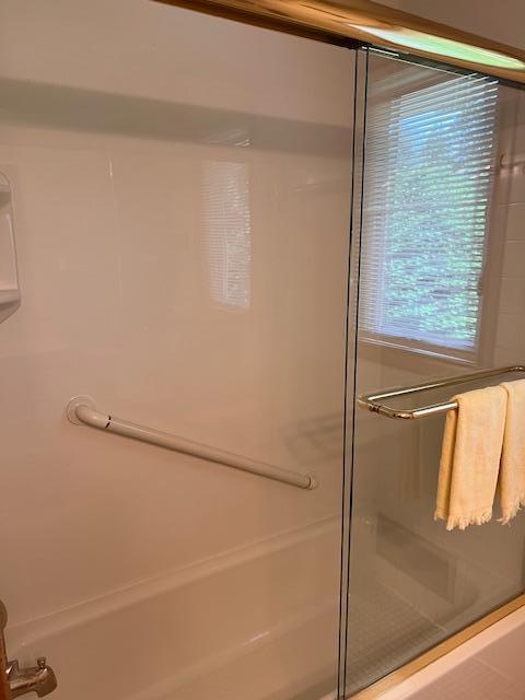 5951 Oakwood Mnr NE, Fridley, MN 55432 - full bath featuring bath / shower combo with glass door