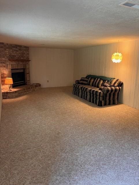 5951 Oakwood Mnr NE, Fridley, MN 55432 - living room featuring carpet flooring, a fireplace, and a textured ceiling