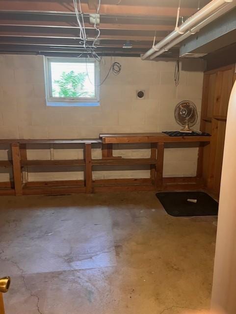 5951 Oakwood Mnr NE, Fridley, MN 55432 - basement featuring concrete block wall and a workshop area