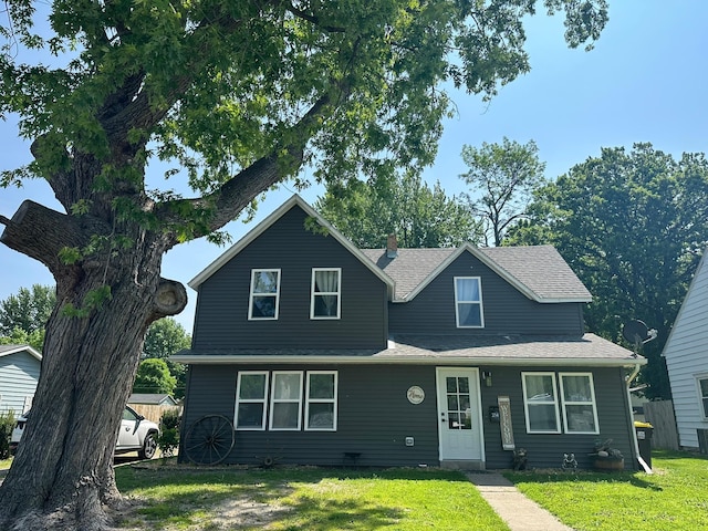 214 Crosby Ave NE, Madelia, MN 56062 - view of front of home featuring a front lawn and a shingled roof