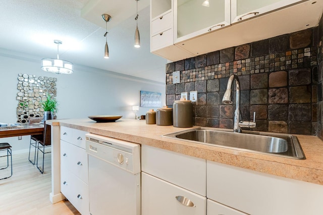 1920 1st St Unit 304, Minneapolis, MN 55454 - kitchen featuring dishwasher, a sink, and white cabinets