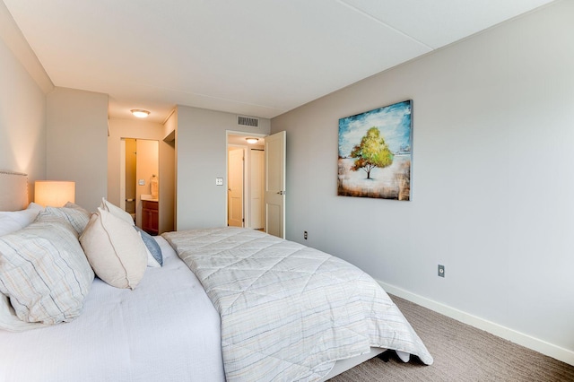 1920 1st St Unit 304, Minneapolis, MN 55454 - carpeted bedroom with baseboards and ensuite bath