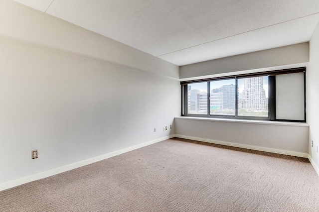 1920 1st St Unit 304, Minneapolis, MN 55454 - unfurnished room with carpet flooring, baseboards, and a textured ceiling
