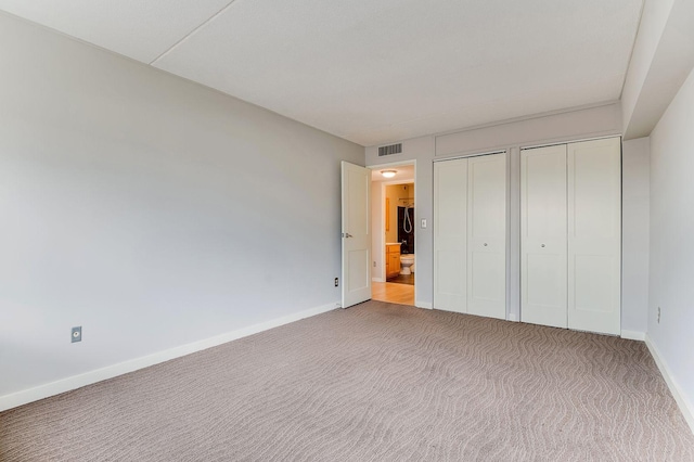1920 1st St Unit 304, Minneapolis, MN 55454 - unfurnished bedroom with two closets, carpet, and baseboards