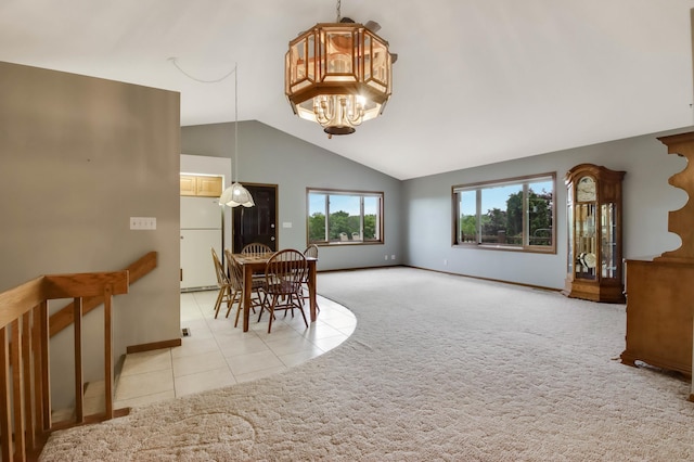 544 22nd St, Sioux Creek Twp, WI 54728 - dining room featuring a chandelier, lofted ceiling, baseboards, tile patterned flooring, and carpet flooring