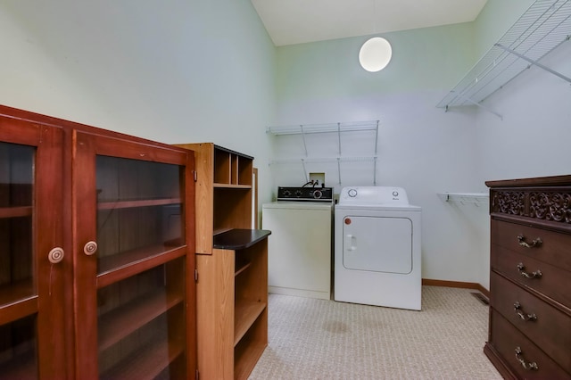544 22nd St, Sioux Creek Twp, WI 54728 - laundry area with washing machine and clothes dryer, light colored carpet, and baseboards