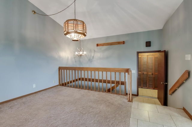 544 22nd St, Sioux Creek Twp, WI 54728 - staircase with a chandelier, baseboards, carpet, tile patterned flooring, and lofted ceiling