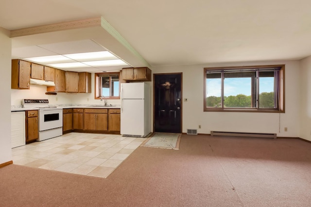 544 22nd St, Sioux Creek Twp, WI 54728 - kitchen with white appliances, a baseboard heating unit, a sink, under cabinet range hood, and brown cabinetry