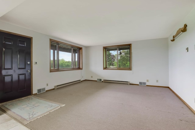 544 22nd St, Sioux Creek Twp, WI 54728 - carpeted foyer with a baseboard heating unit, plenty of natural light, and baseboards