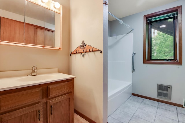 544 22nd St, Sioux Creek Twp, WI 54728 - full bathroom with vanity, heating unit, baseboards, tile patterned floors, and shower / bath combination