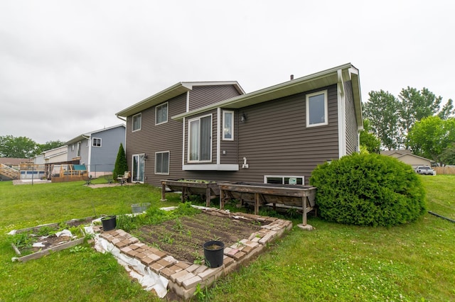 920 9th St, Rush City, MN 55069 - back of house featuring a yard