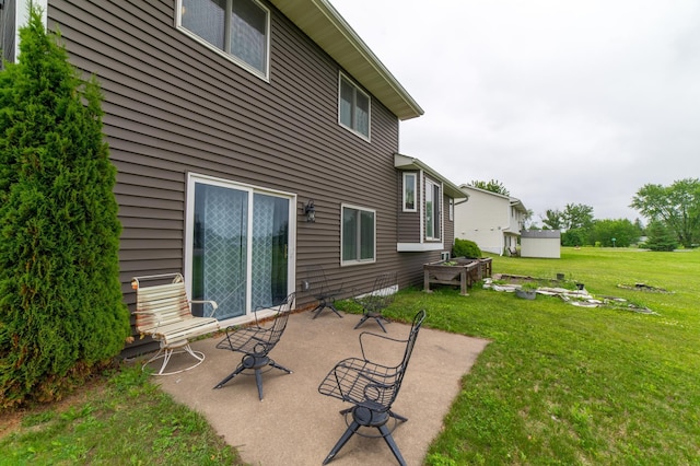 920 9th St, Rush City, MN 55069 - rear view of property with a patio and a lawn
