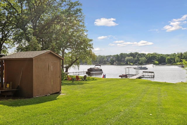 7469 Fernbrook Ln N, Maple Grove, MN 55311 - view of grassy yard featuring a water view and a dock