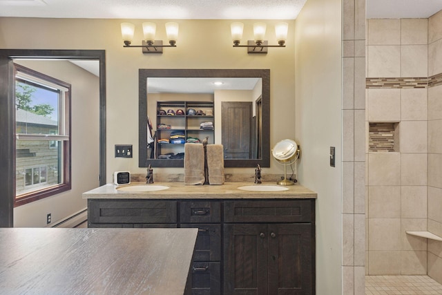 7469 Fernbrook Ln N, Maple Grove, MN 55311 - full bath with double vanity, tiled shower, and baseboard heating