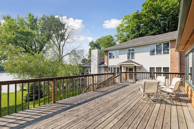 7469 Fernbrook Ln N, Maple Grove, MN 55311 - wooden deck featuring outdoor dining area