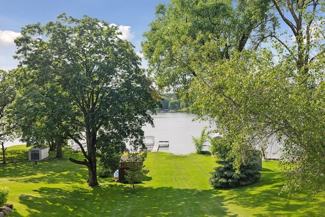 7469 Fernbrook Ln N, Maple Grove, MN 55311 - view of green lawn featuring a water view and a dock