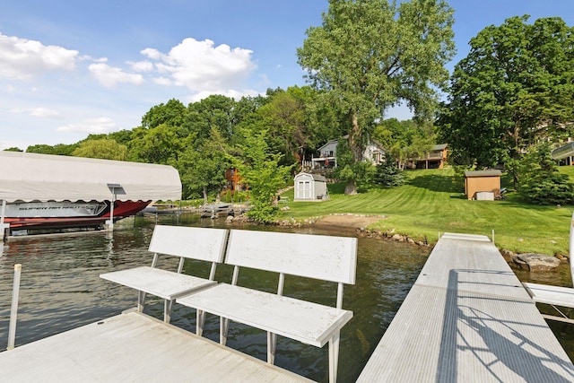 7469 Fernbrook Ln N, Maple Grove, MN 55311 - dock featuring a water view, a yard, and boat lift