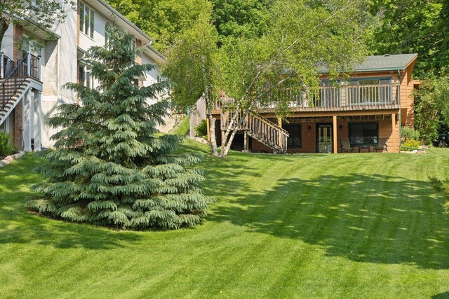7469 Fernbrook Ln N, Maple Grove, MN 55311 - view of green lawn featuring stairs and a deck