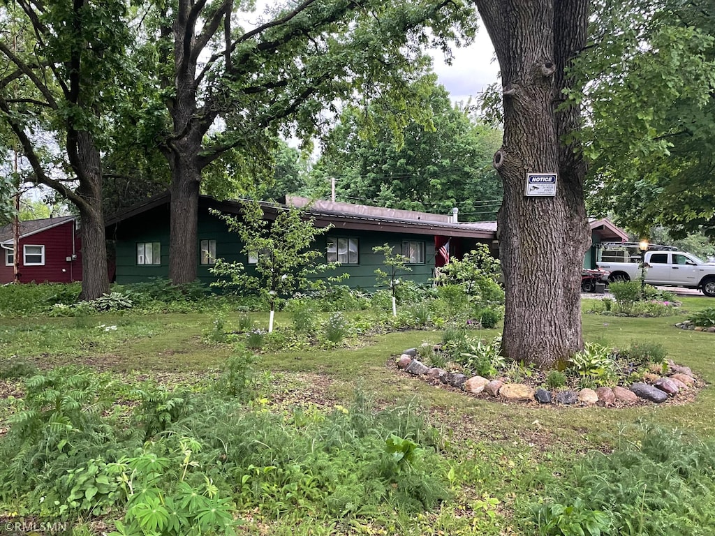 211 Dion Ave, Mora, MN 55051 - view of front facade with a front lawn
