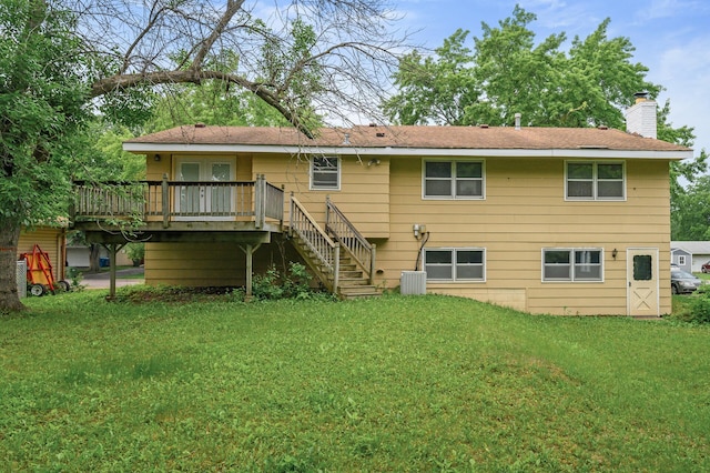 1813 Stinson Blvd, New Brighton, MN 55112 - rear view of house with a chimney, a deck, a yard, and stairway